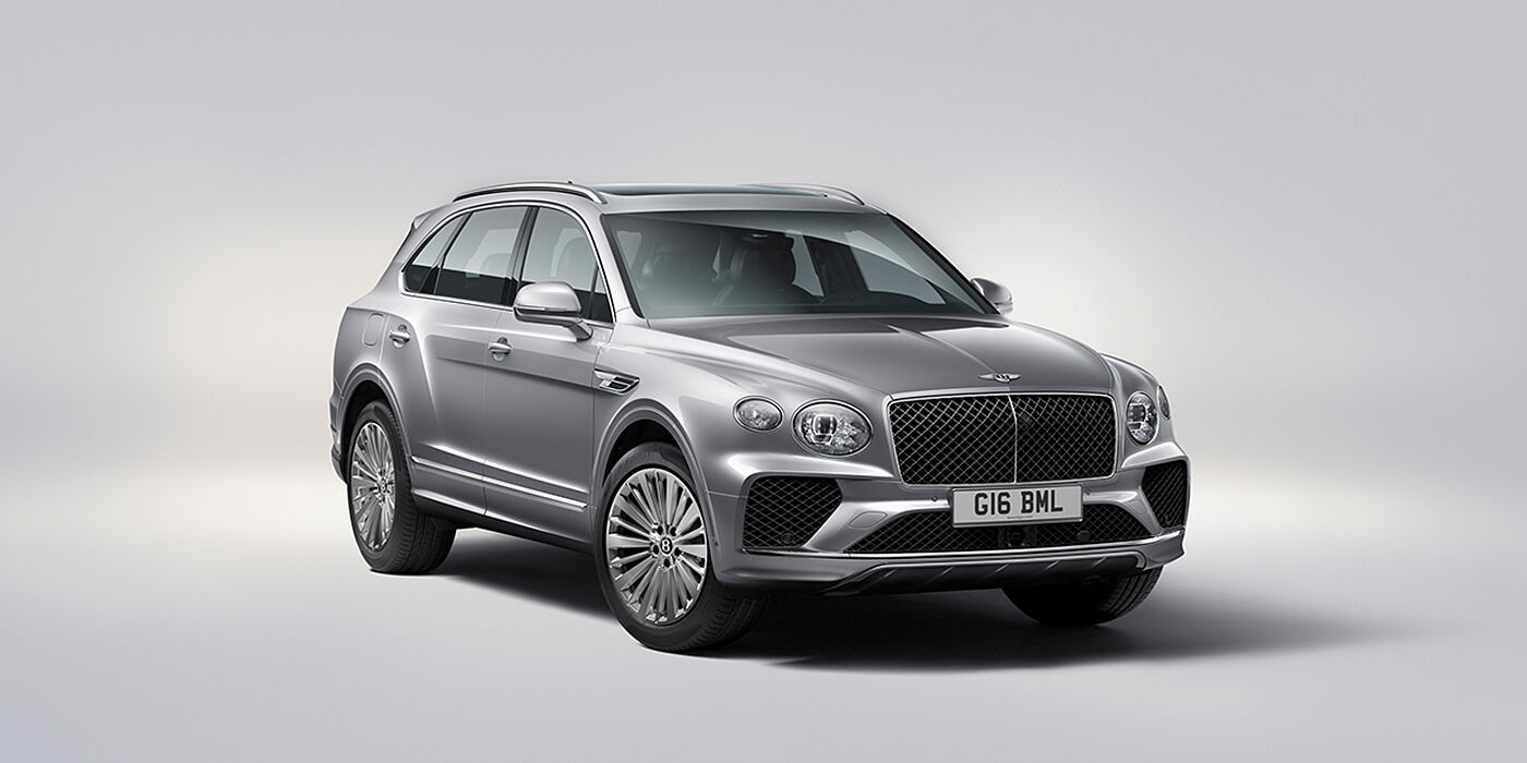 Bentley Lisboa Bentley Bentayga luxury SUV front three quarter view in Moonbeam paint with matrix grille and 21″ 5 spoke painted wheels