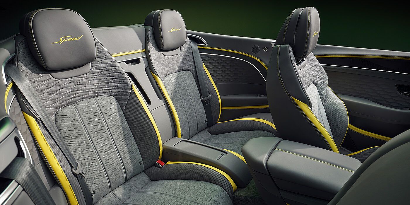 Bentley Lisboa Bentley New Continental GTC Speed convertible rear interior with unique Speed colour split in Gravity Grey and Cyber Yellow hide colours, and contrast stitched headrest emblems 