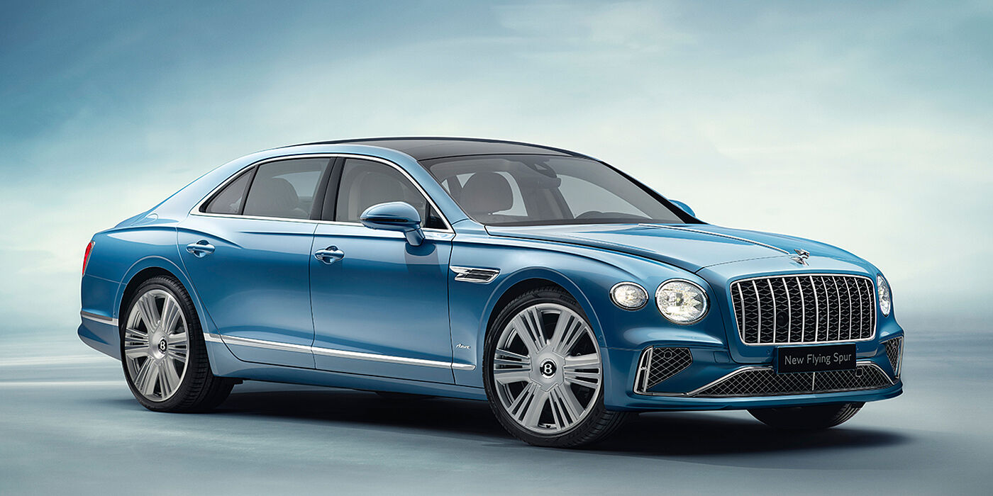Bentley Lisboa New Bentley Flying Spur Azure sedan front view in Light windsor blue by Mulliner paint with 22 inch Azure wheels and chrome exterior details